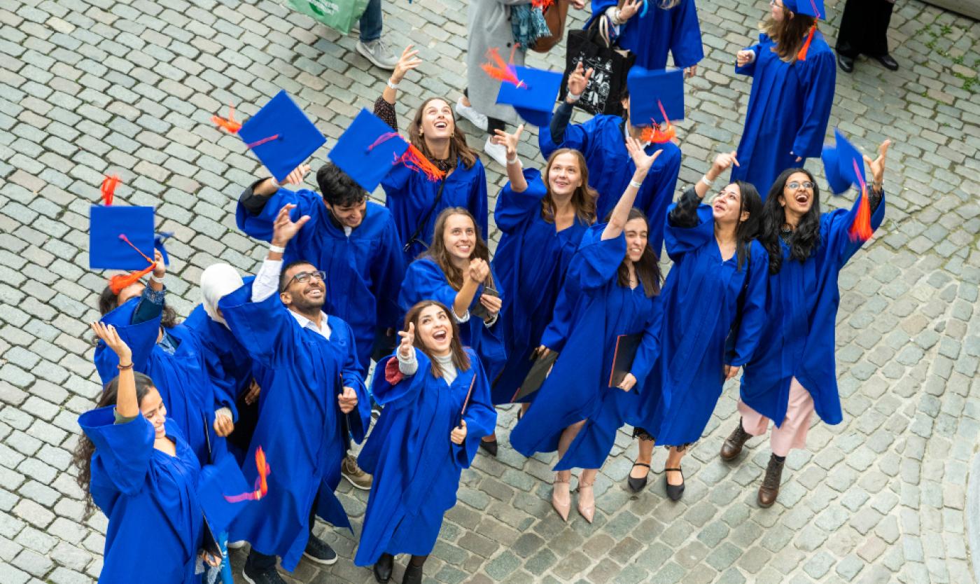 students graduating grand place