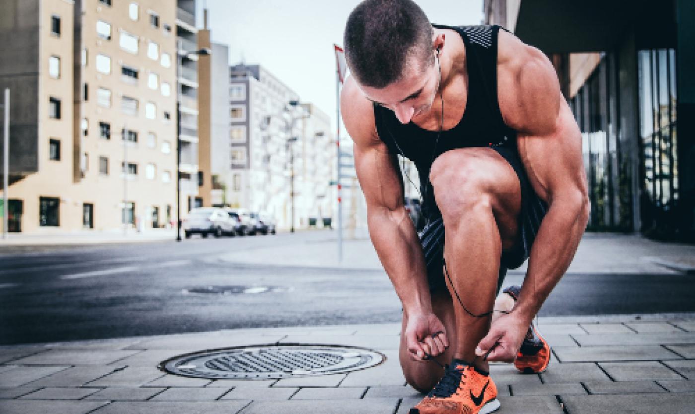 Sports performance Man getting ready to run