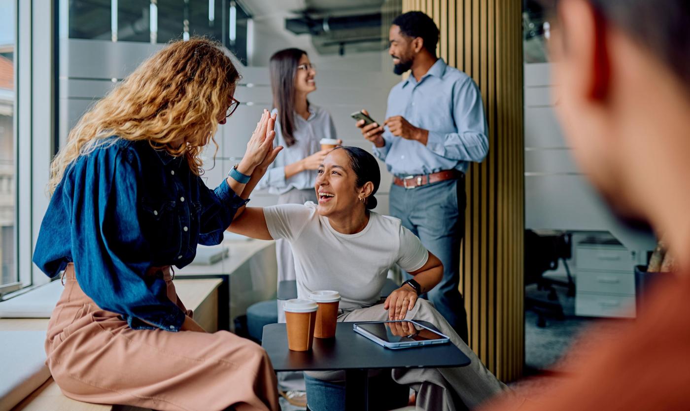 Diverse business colleagues high-fiving