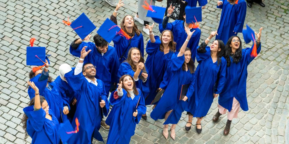 students graduating grand place