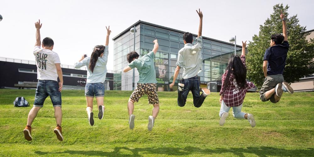 Students jumping at VUB Main Campus