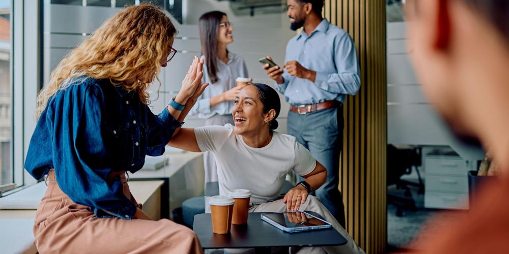Diverse business colleagues high-fiving